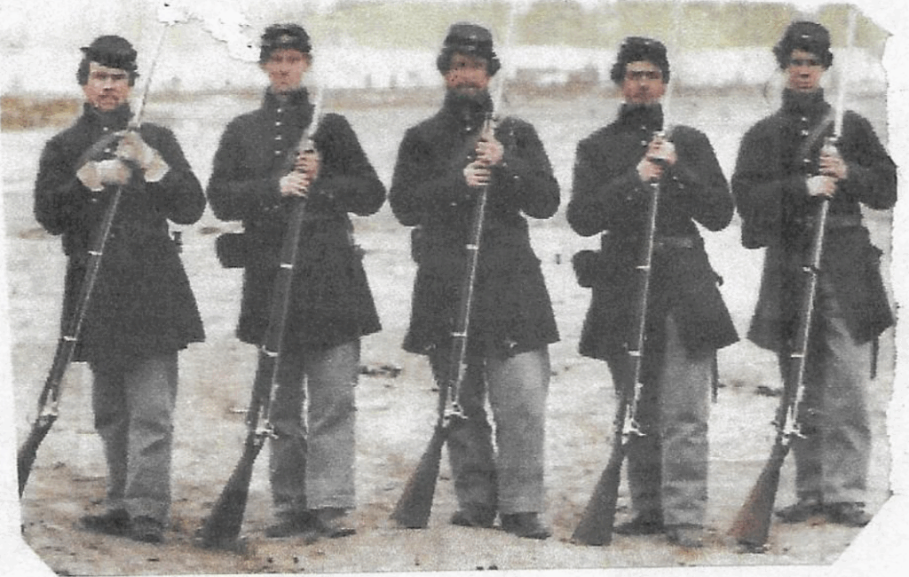 historial image of 5 soldiers with guns