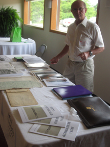 Joe Hodgon helping with books & information on display at the event